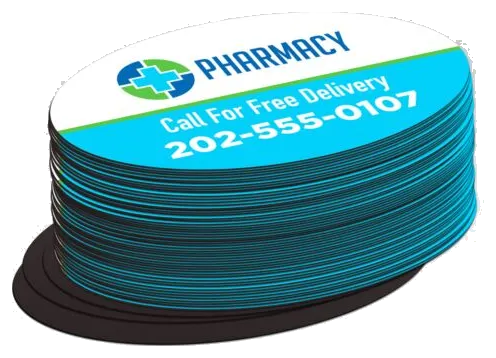 Oval pharmacy magnets stacked on a black magnet
